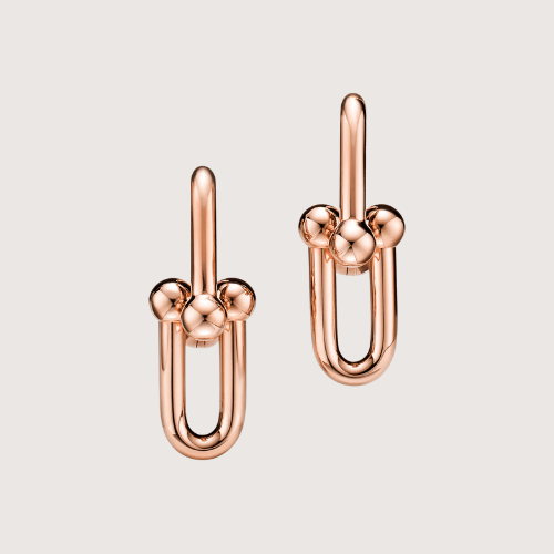 Playful Orbit Link Earrings Showcasing Bold Curves And Elevated Contemporary Character